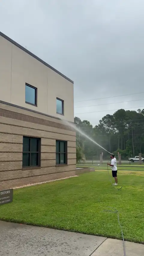 Commercial building pressure washing by The Stream Team